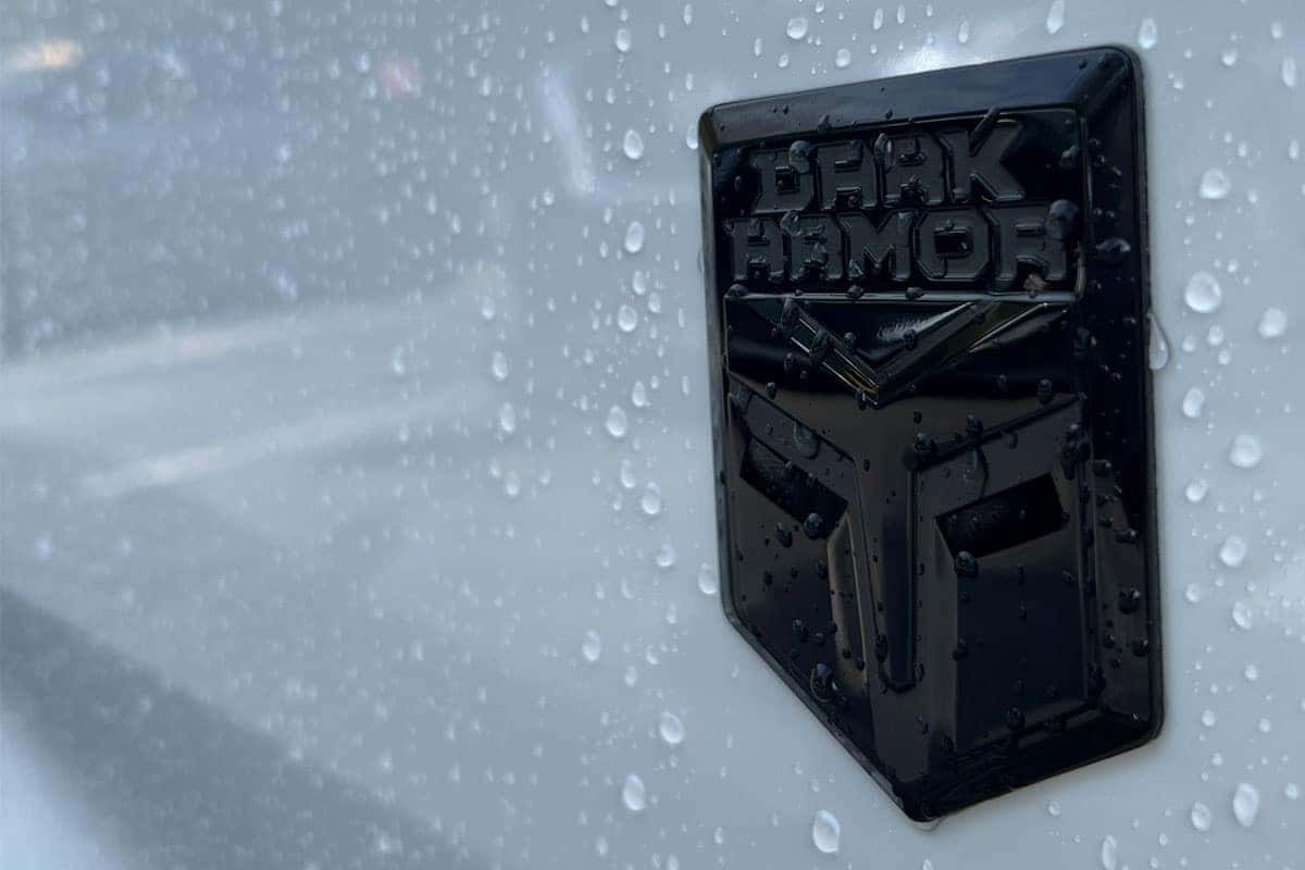 Close-up of the Dark Armor edition logo on the 2027 Nissan Murano Two-Tone Everest White exterior color near Cleveland, Ohio