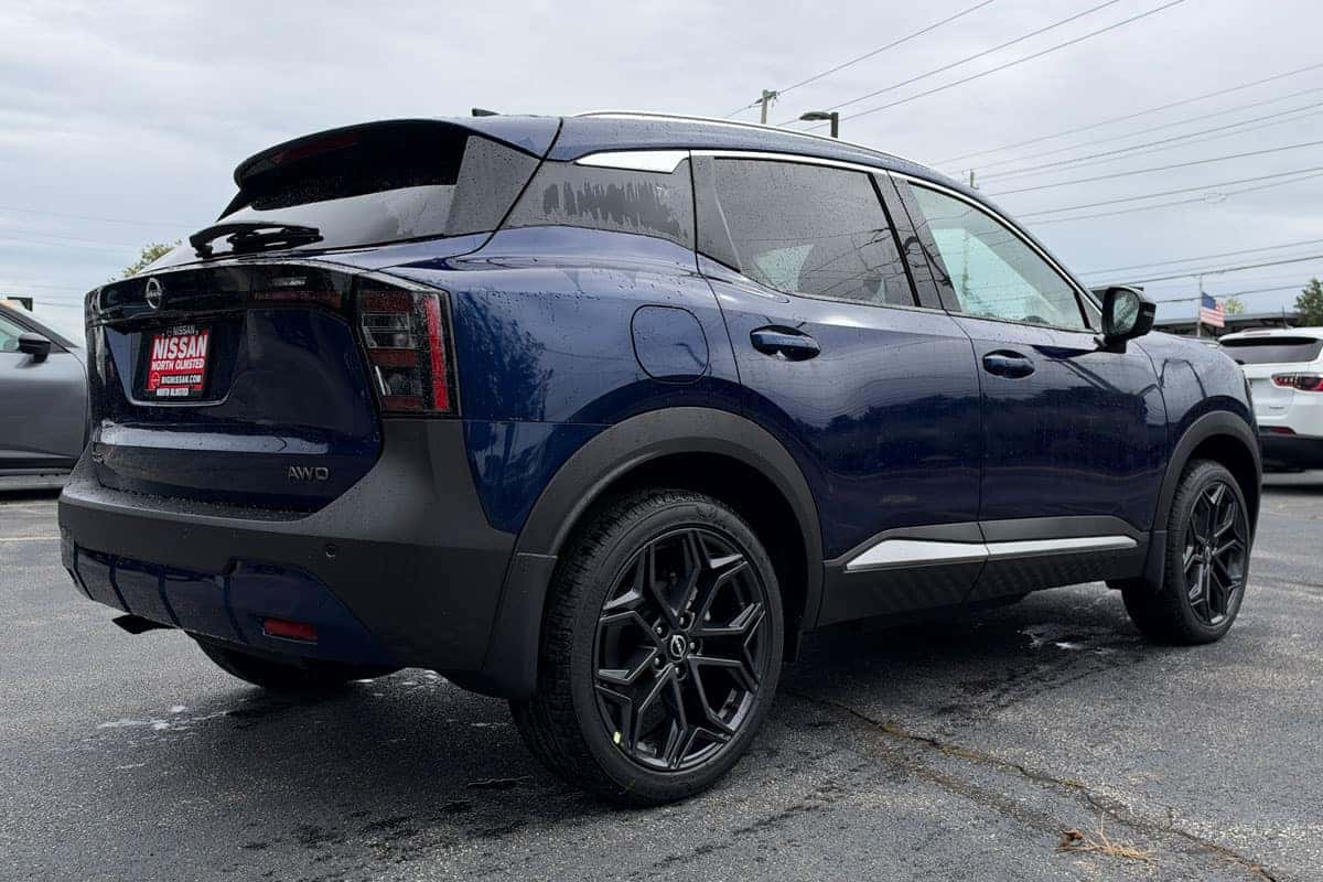 Passenger-side rear three-quarter view of a 2027 Nissan Kicks in Deep Blue Pearl at Nissan of North Olmsted
