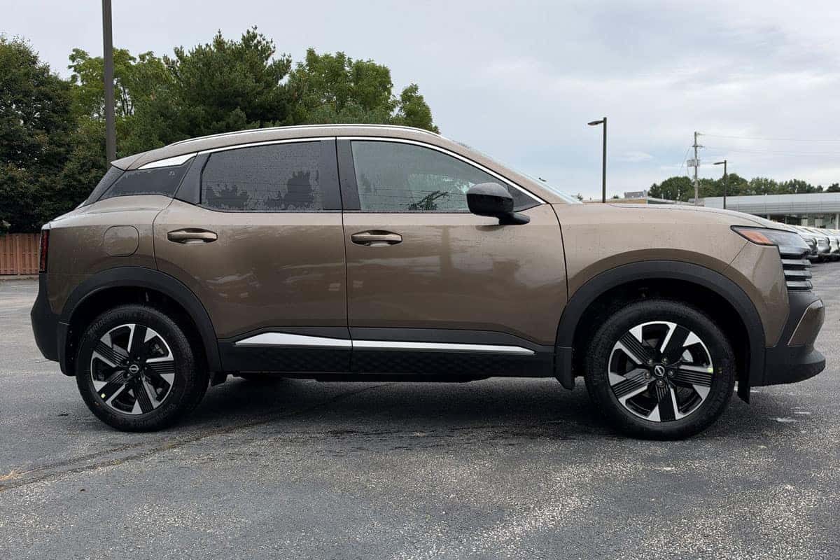 Passenger side view of a 2027 Nissan Kicks in Canyon Bronze Metallic near Cleveland, Ohio