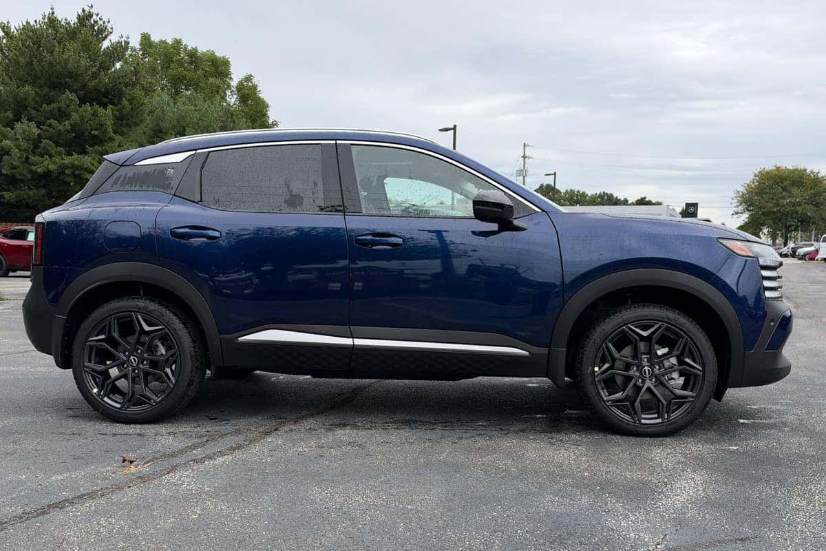 Passenger side view of a 2027 Nissan Kicks in Deep Blue Pearl near Cleveland, Ohio
