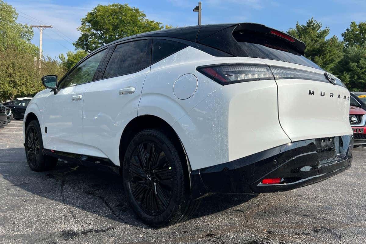 Rear driver side three-quarter view of the 2027 Nissan Murano Two-Tone Everest White exterior color near Cleveland, Ohio