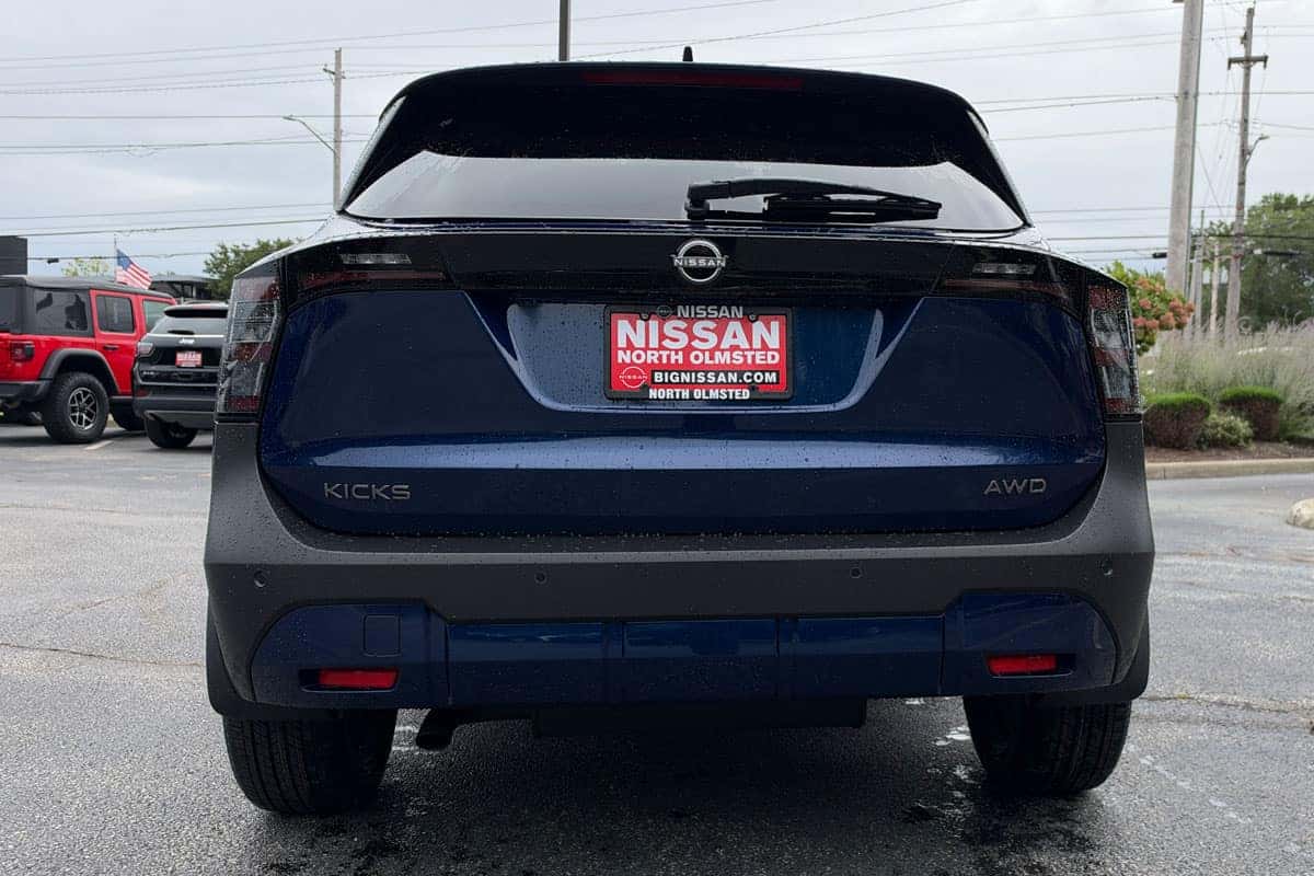 Rear view of a 2027 Nissan Kicks in Deep Blue Pearl near Cleveland, Ohio