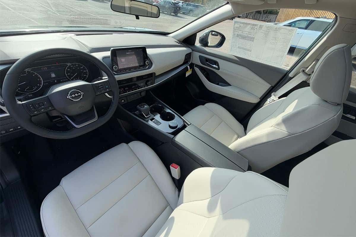 2027 Nissan Rogue dashboard and front seating of the 2027 Nissan Rogue near Cleveland, Ohio