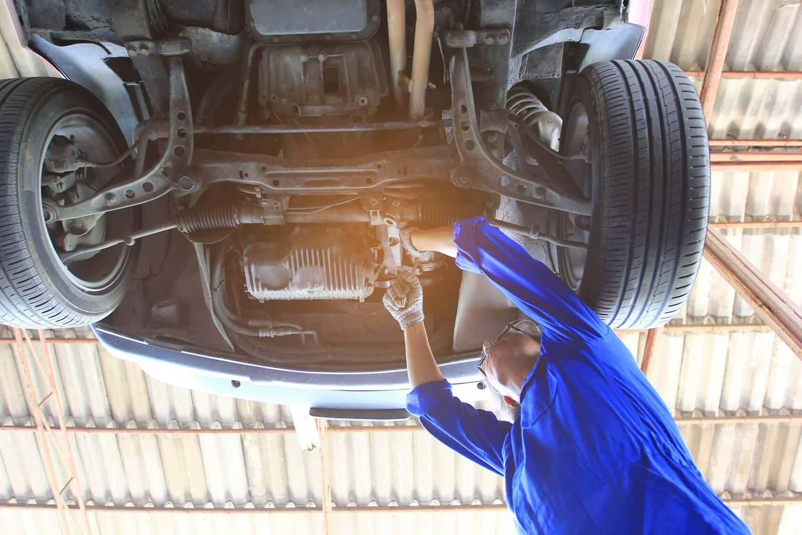 Expert technician working in a car
