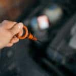 pulling out oil dip stick