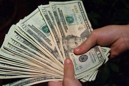 20 dollar bills in hand