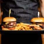 cheeseburgers on a serving tray
