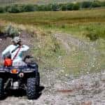 woman riding atv on a trail