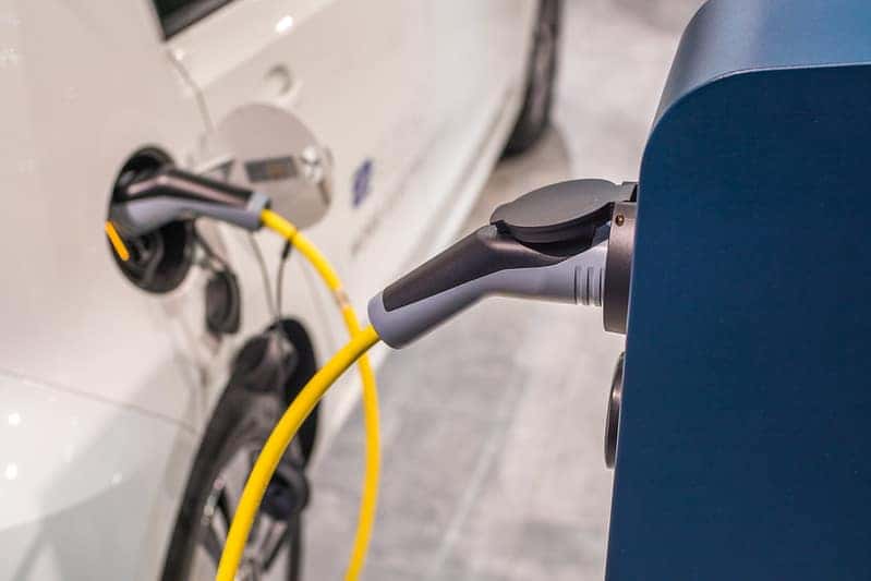 an electric car being charged at a charging station