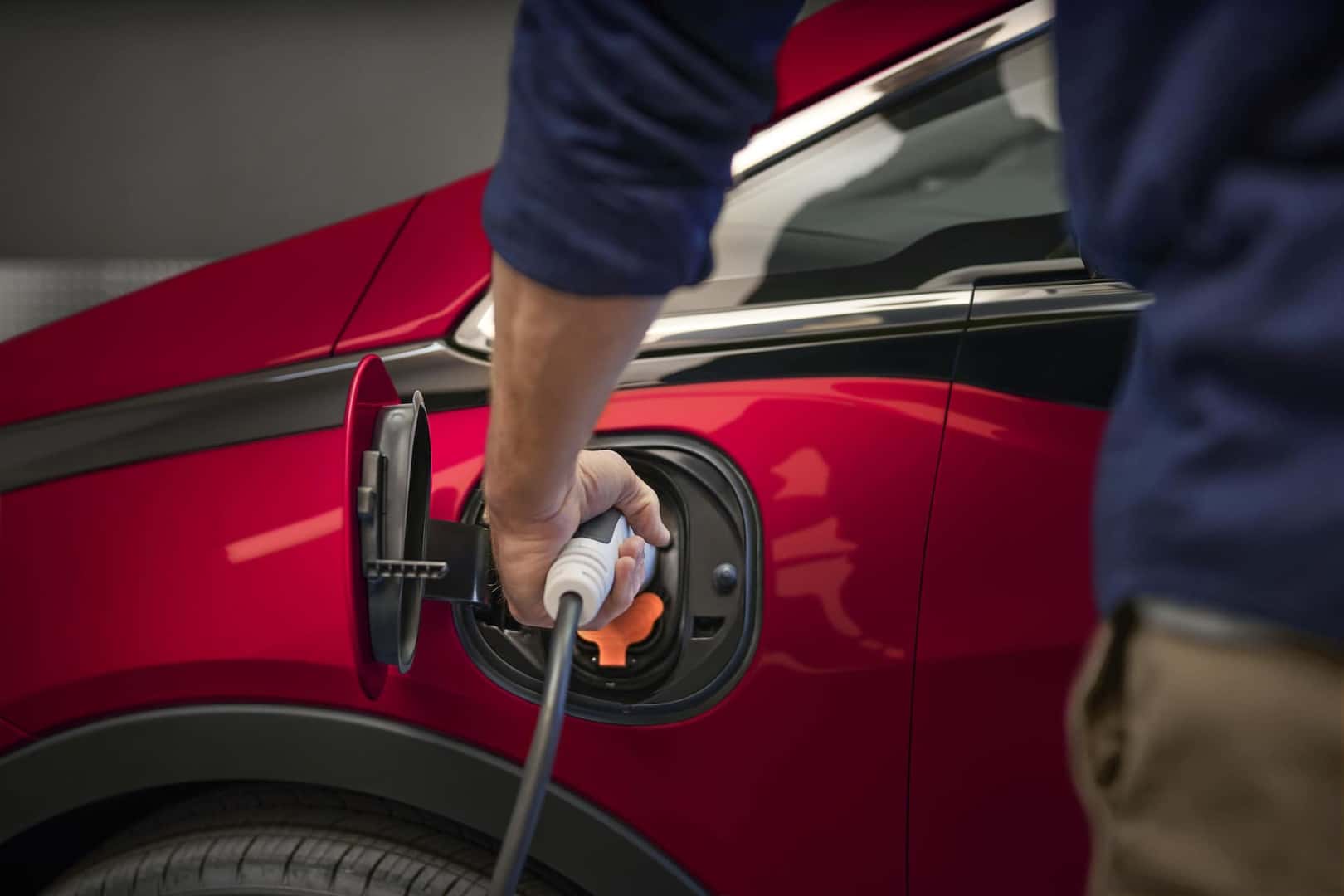 2023 Bolt EV Man Charging a Bolt EV