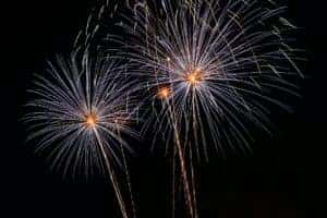 Three bright Fireworks going off at the same time in the night Sky