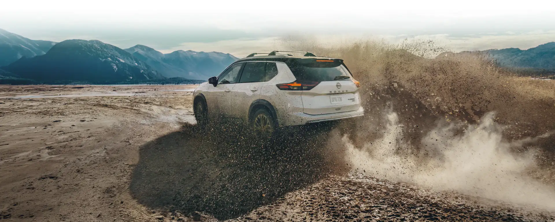 Nissan Rogue driving confidently on rugged terrain