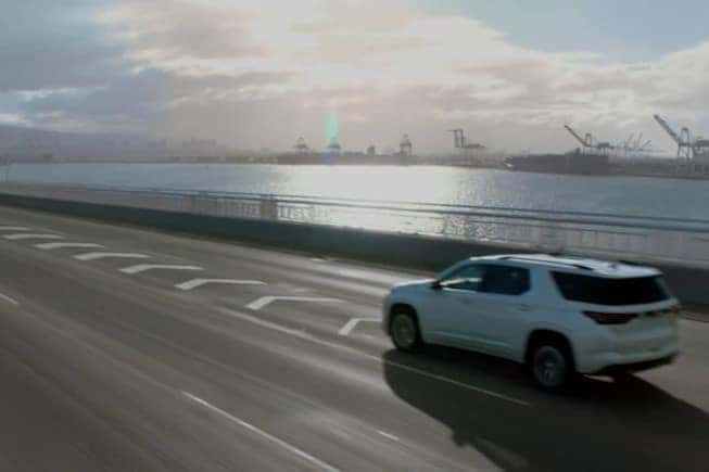 Traverse Driving Past Water