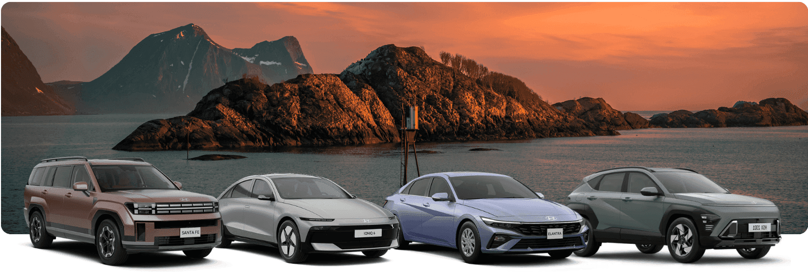 Genesis cars lined up against a scenic background