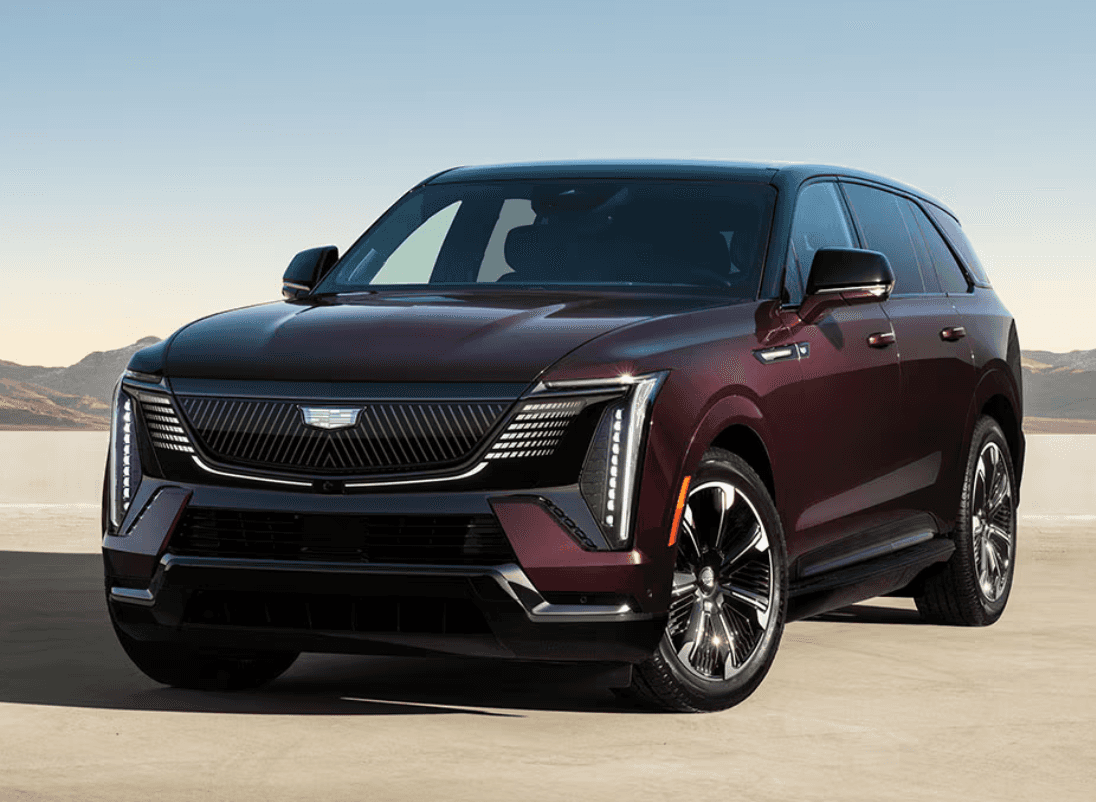 Burgundy 2026 Cadillac Escalade with mountains in background